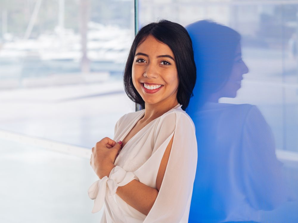 Young woman in beautiful dress smiling