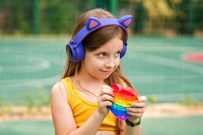 School girl with rainbow toy