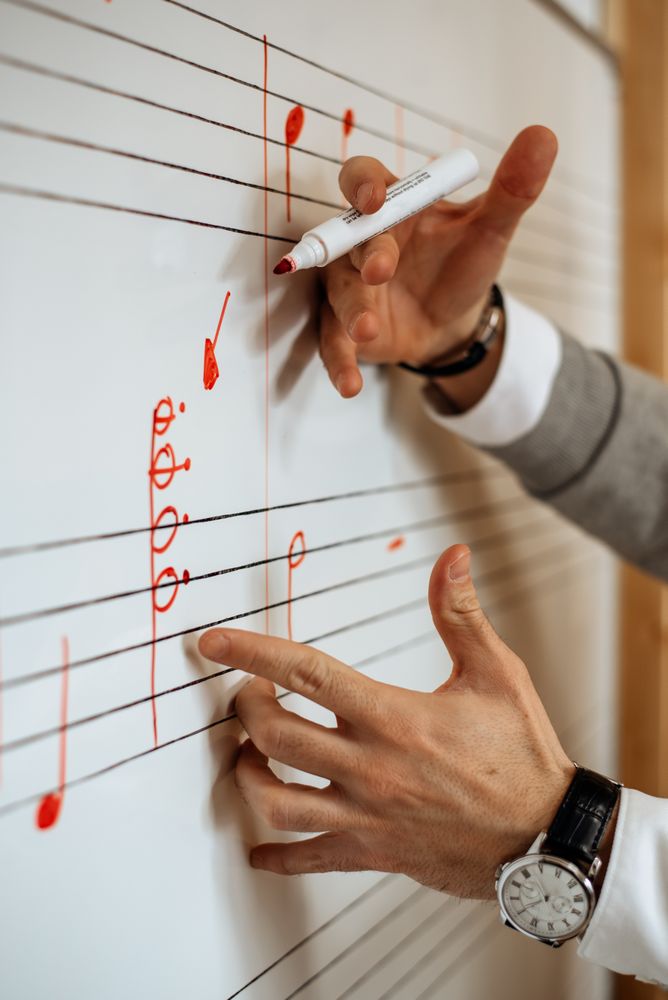 Man writing music notes