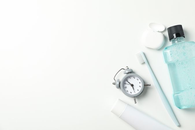 Tools for dental care on light background, space for text