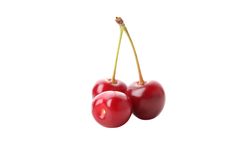Three cherries on blank background