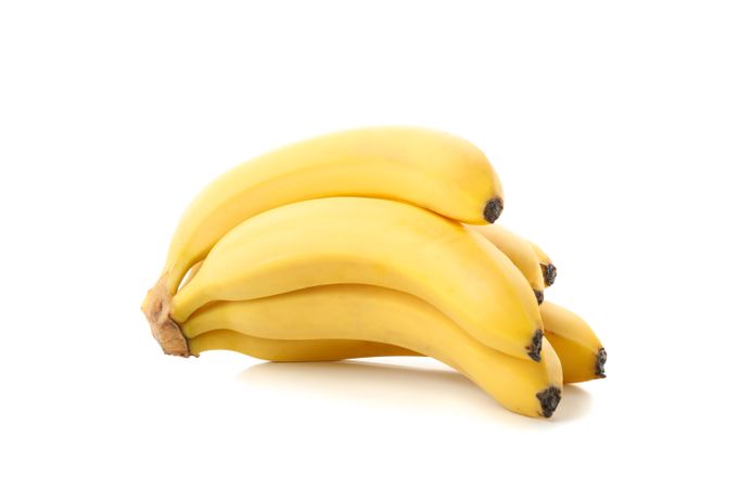 Banana cluster isolated on light background. Fresh fruit