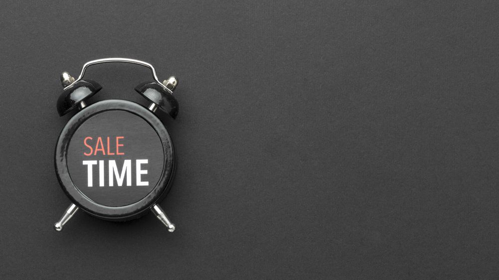 Sale concept with alarm clock and copy space