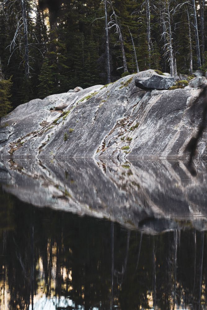 reflection of rock in water