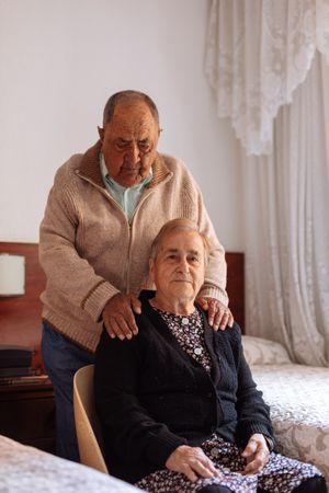 older couple in interior of their house