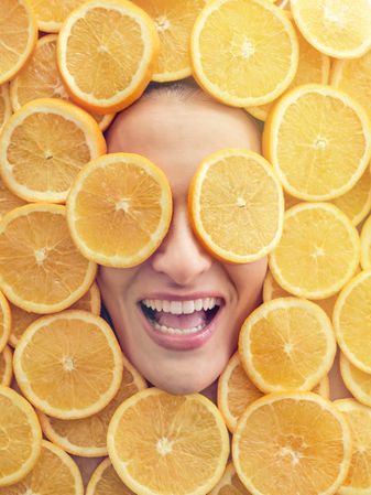 Excited woman in orange pieces