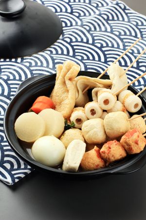 Japanese oden, bowl of skewers and dumplings