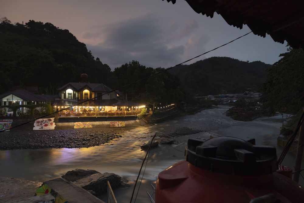 Bukit Lawang, Indonesia - January 22, 2020: Night falls on the Bohorok River in Sumatra