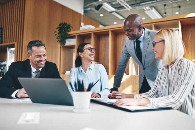 Group of happy people working in a modern, open office