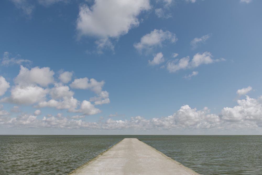 empty concrete quay on cloudy day