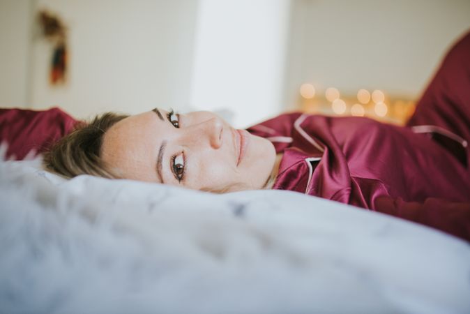 Woman and smiling in bed
