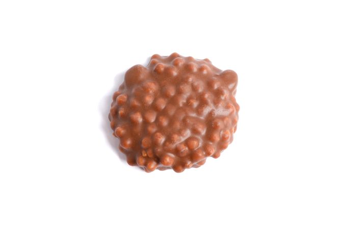Chocolate cookie with caramel filling isolated on plain background