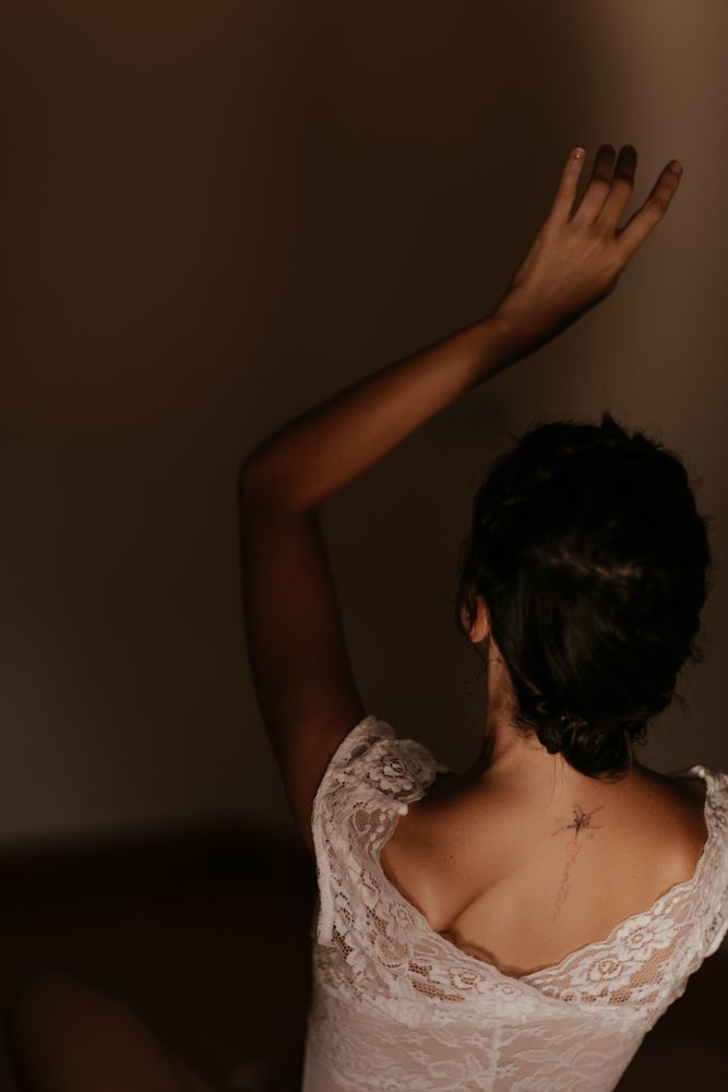 woman sitting in dark room