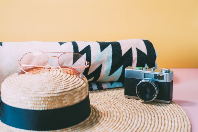 Summer trendy sunglasses, towel, hat and camera