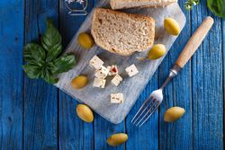 Cubes of cheese on breadboard
