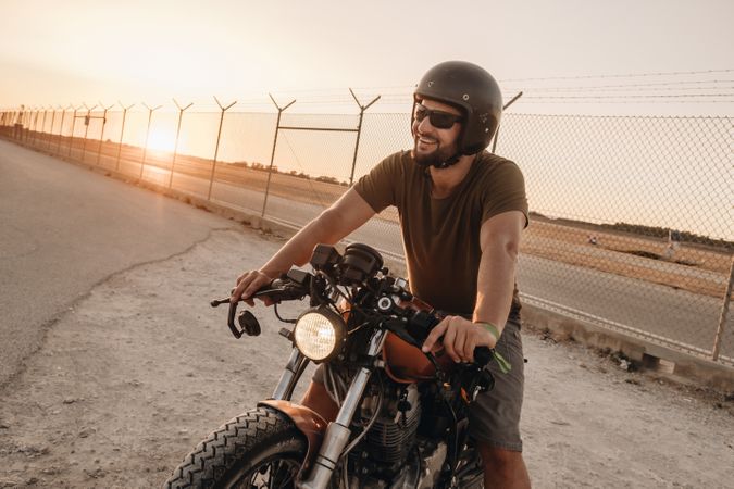 Strong man driving motorcycle