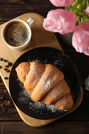 Vertical top view of pastry with coffee