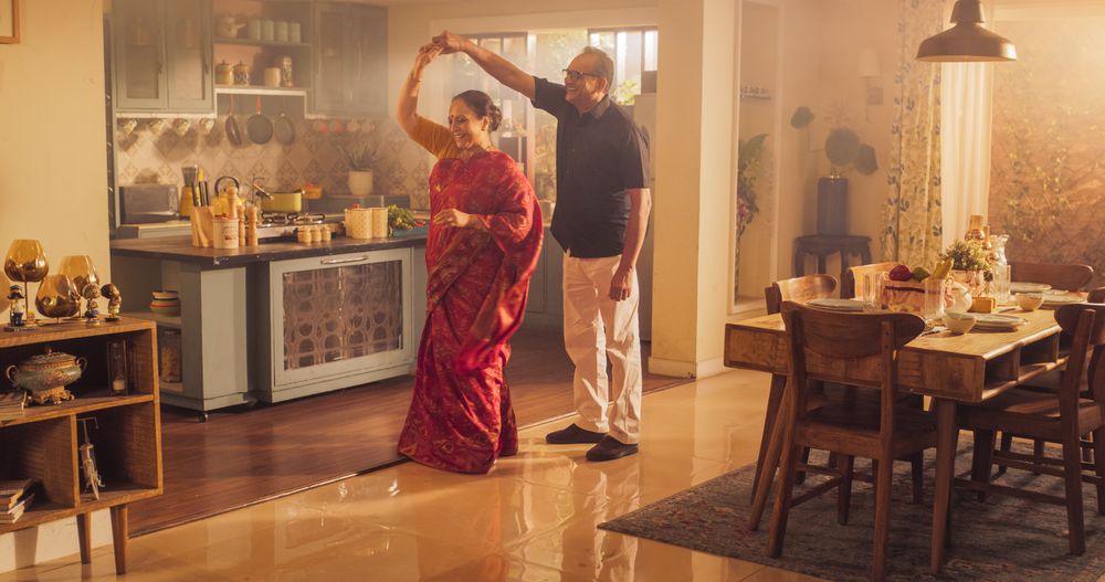 Older Couple Dancing Kitchen and Enjoying Each Other's Company