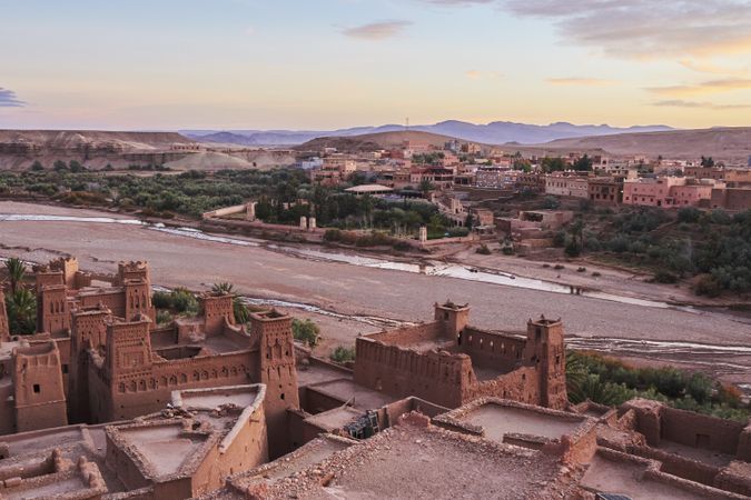 Ancient city near river in desert and wonderful sky
