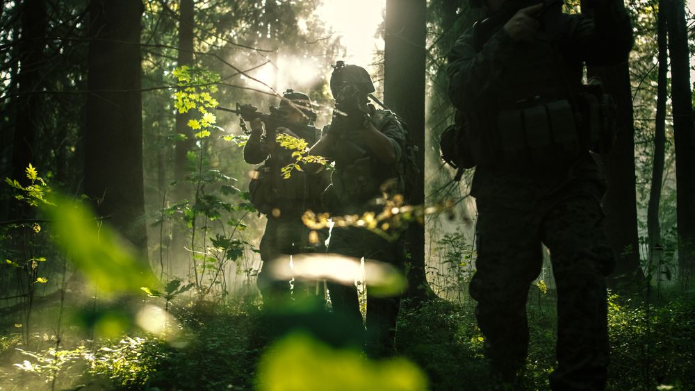 Squad of Five Fully Equipped Soldiers in Camouflage on a Reconnaissance Military Mission