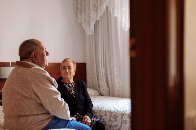older couple in interior of their house