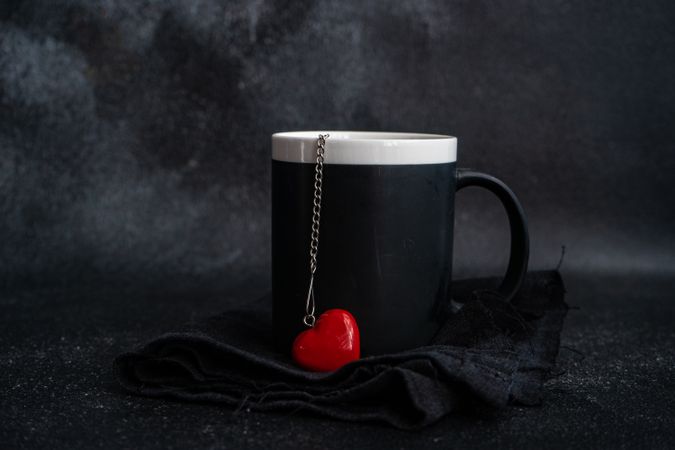 Mug with bright red heart ornament