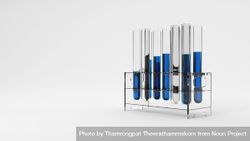 Test tubes with blue liquid in rack, copy space 5pwaO0