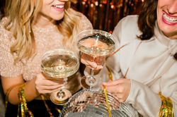 Close Up of cheerful woman at Party Making Champagne Toast Together