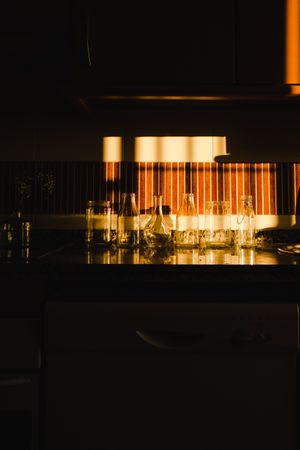 empty glasses under dramatic light in kitchen