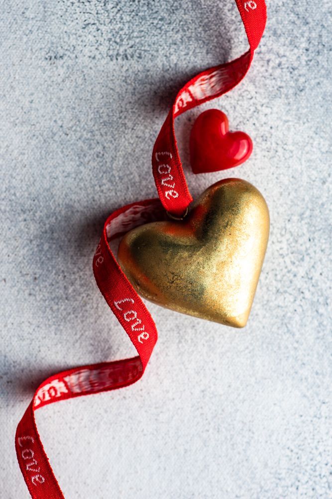 St Valentine day concept with gold and red decorations