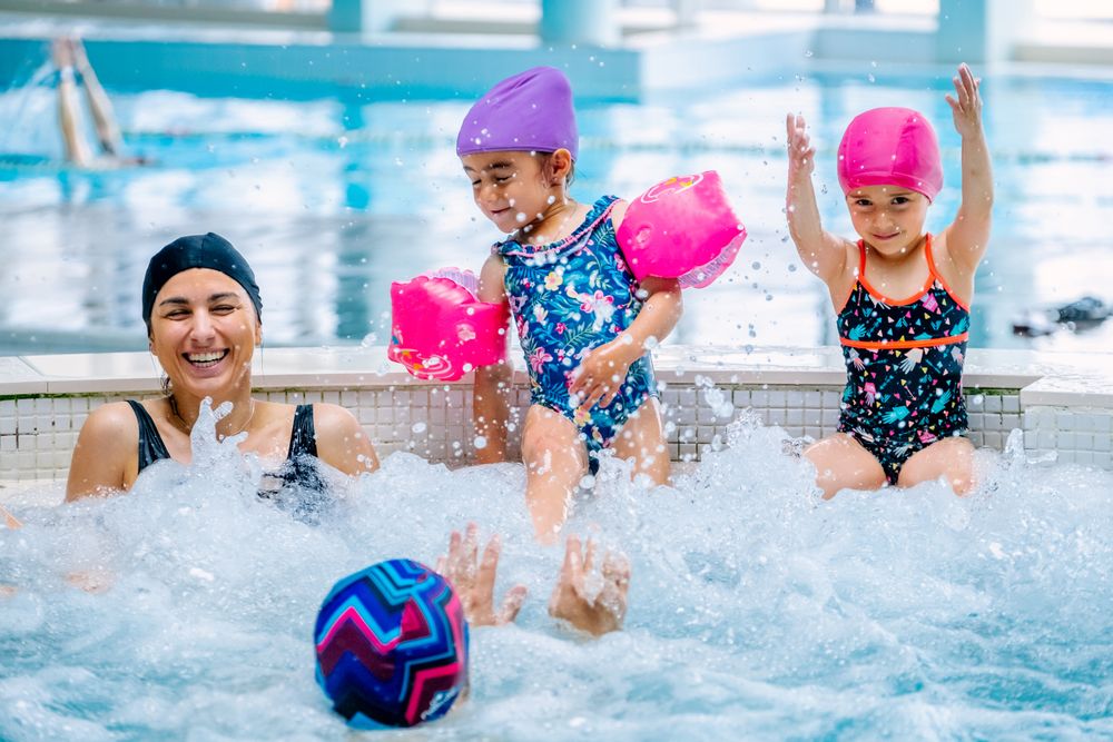 Family relaxing in bubbling pool