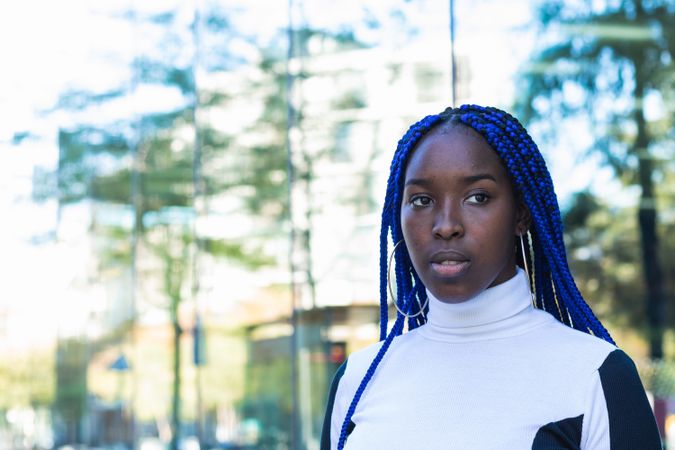 Thoughtful Black woman on street