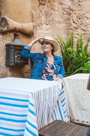 Woman sitting on the terrace of a restaurant