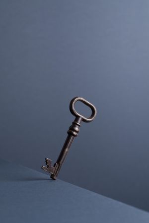 Vintage key over dark background