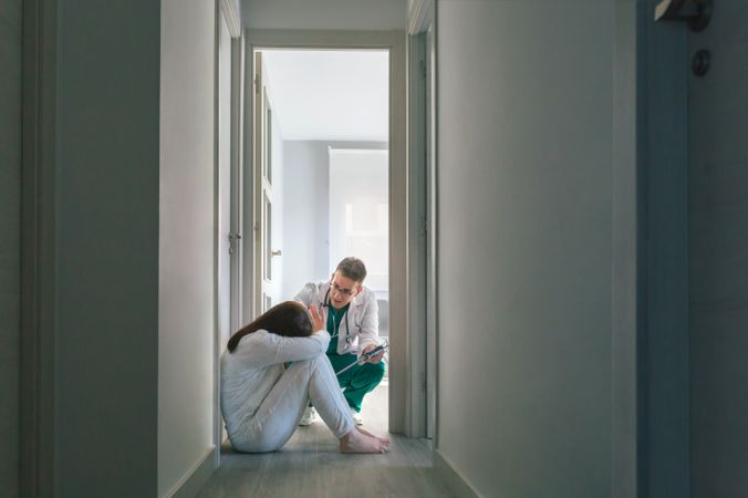 Doctor trying to help patient who refuses help