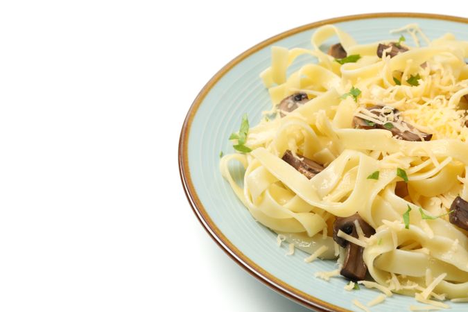 Plate with pasta, cheese and mushrooms isolated on plain background