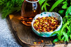 Fresh herbs with chili flakes and oil