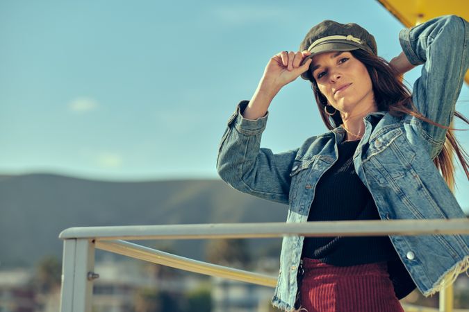 female standing on balcony on nature
