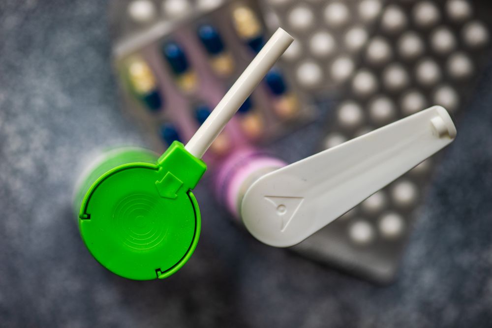 Top view of hand sanitizer pumps and pills