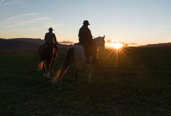 Man and woman riding horses