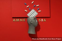 Bust with pills and the words “Amnesia” bY9NGb