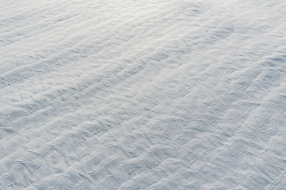 Snow-covered white fields in Alsace, top view.