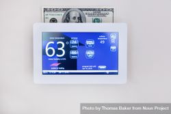 Saving money with technology on home thermostat for heating and cooling 4Aramb