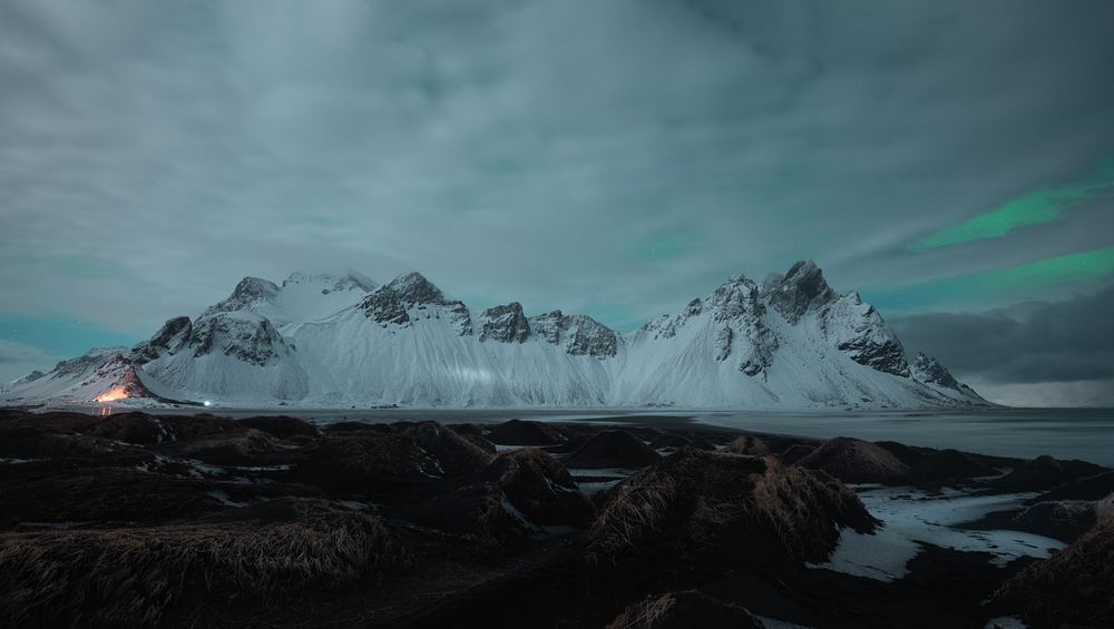 Snowy mountains covering with the fog