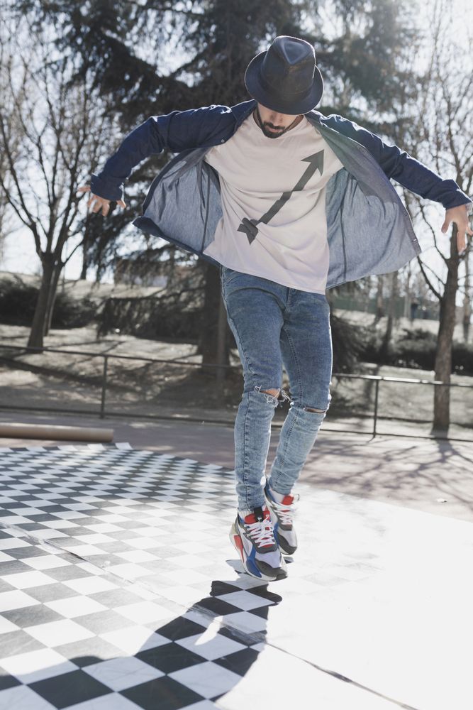 Man dancing break dance in park