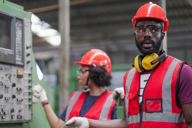 Two mechanics worker in heavy factory