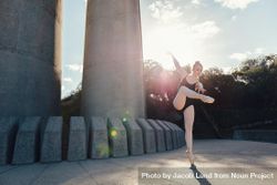 Female dancer standing on one toe in pointe shoes practicing her dance steps 4mxWd5
