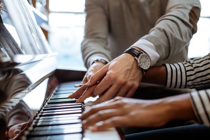 Woman learning to play piano