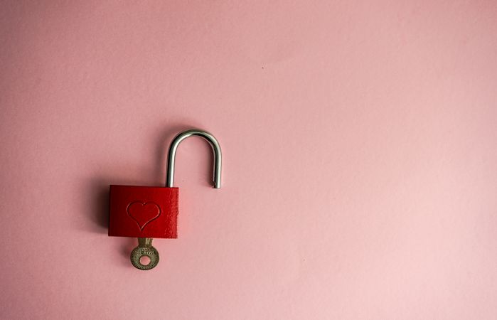 Valentine's concept with red padlock in pink background