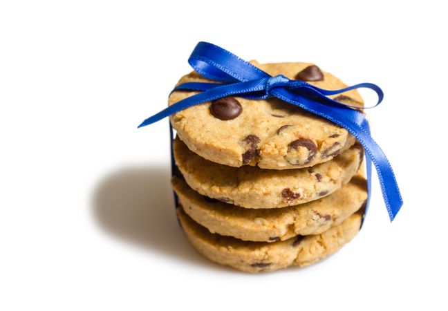 Closeup of chocolate chip cookies pile isolated on blank background